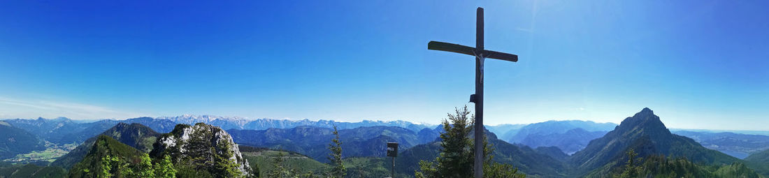 Scenic view of snowcapped mountains against clear blue sky