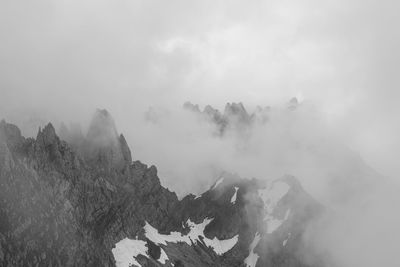 Scenic view of kaiser mountains during foggy weather