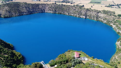 High angle view of trees and blue lake