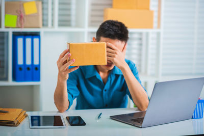 Man using laptop on table