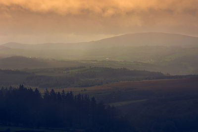 Scenic view of landscape against sky during sunset