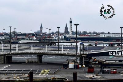 View of bridge in city against sky