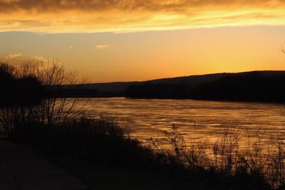 Scenic view of landscape against sky during sunset