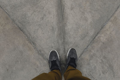 Low section of man standing on floor