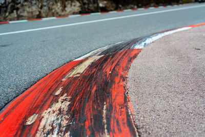 Close-up of red marking on road