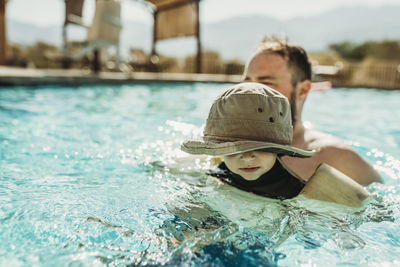 Boy swimming in pool