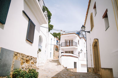 Narrow street amidst buildings in town