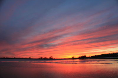 Scenic view of sunset over river