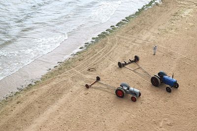 High angle view tractors at beach