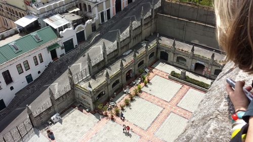 High angle view of woman walking on road