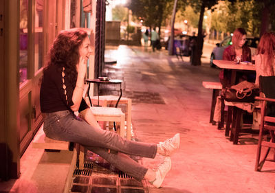 Woman sitting outdoors