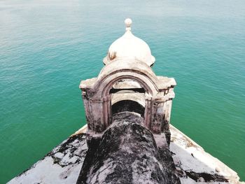 High angle view of building by sea against sky