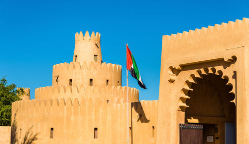 Low angle view of building against blue sky