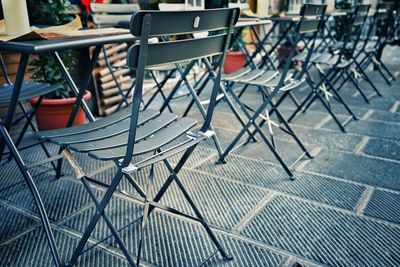 Empty chairs and tables at cafe