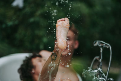 Portrait of shirtless woman in water