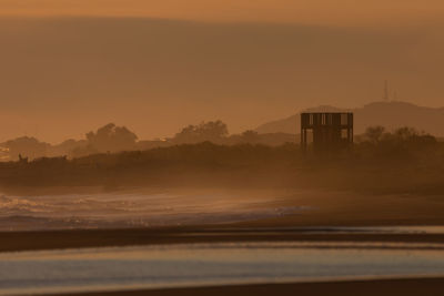Scenic view of mountains against sky during sunset