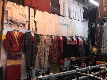 Clothes hanging in store for sale at market stall