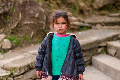 Portrait of girl standing outdoors