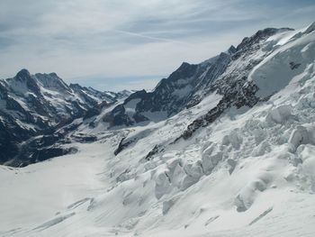 Scenic view of snowcapped mountains against sky