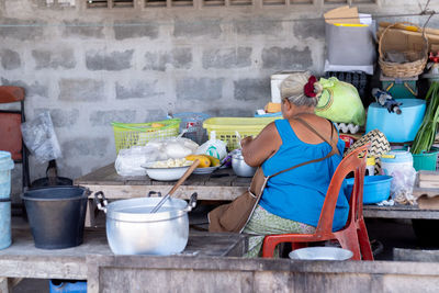 People working at market stall