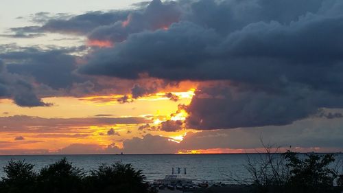 Scenic view of sea against dramatic sky