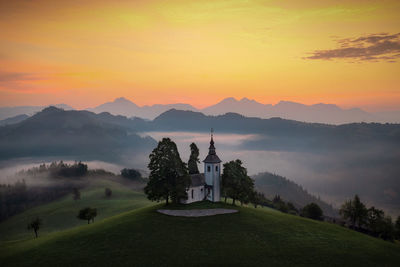 Scenic view of mountains against sky during sunset