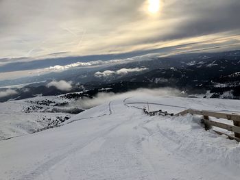 Scenic view of snow covered mountains against sky