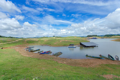 High angle view of boats moored on shore against sky