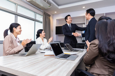 Business colleagues working at office