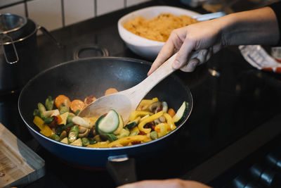Person preparing dinner in kitchen