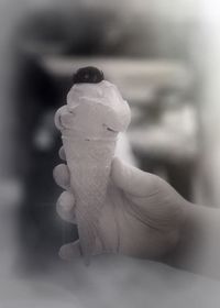 Close-up of hand holding ice cream