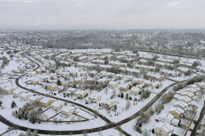 High angle view of buildings in city against sky