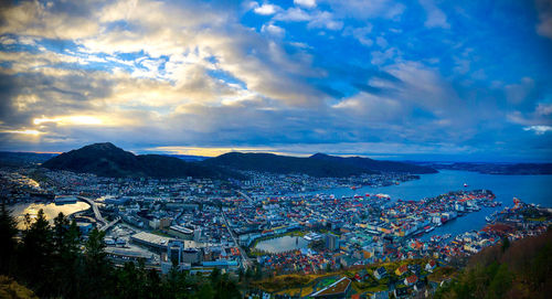 High angle shot of illuminated cityscape against sky