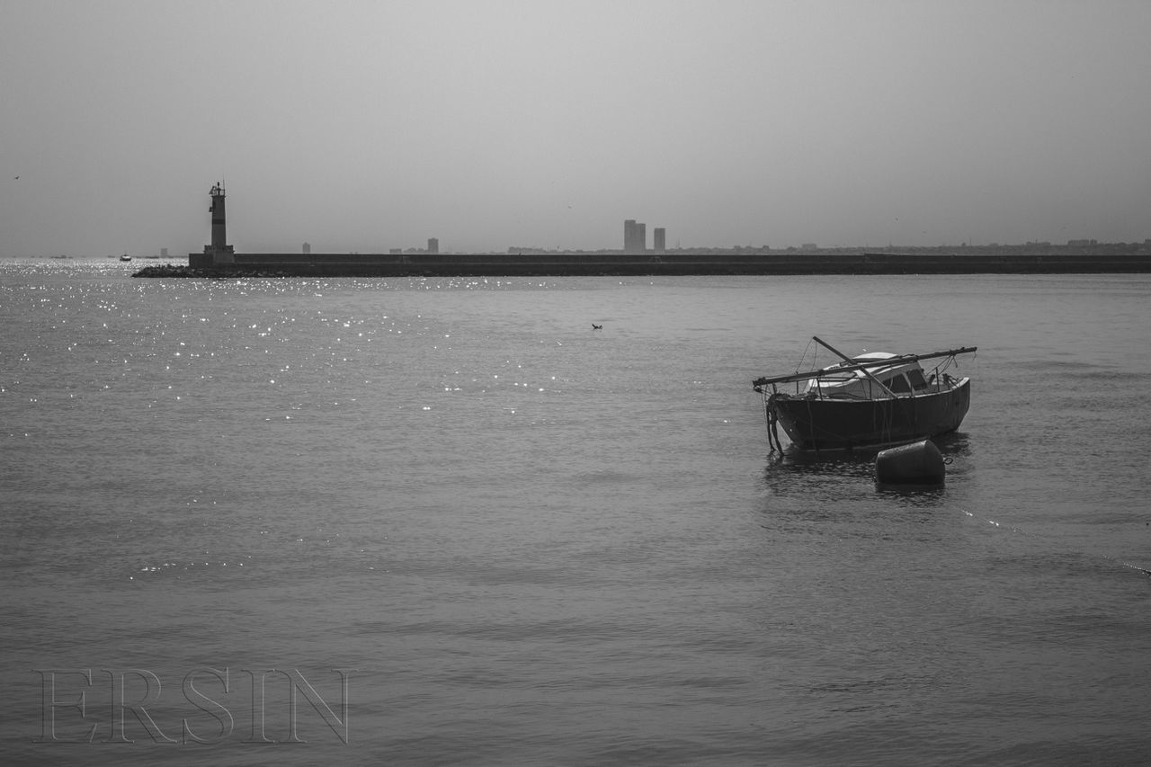 BOATS SAILING IN SEA