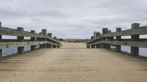 View of footbridge against sky