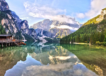 Scenic view of lake and mountains against sky