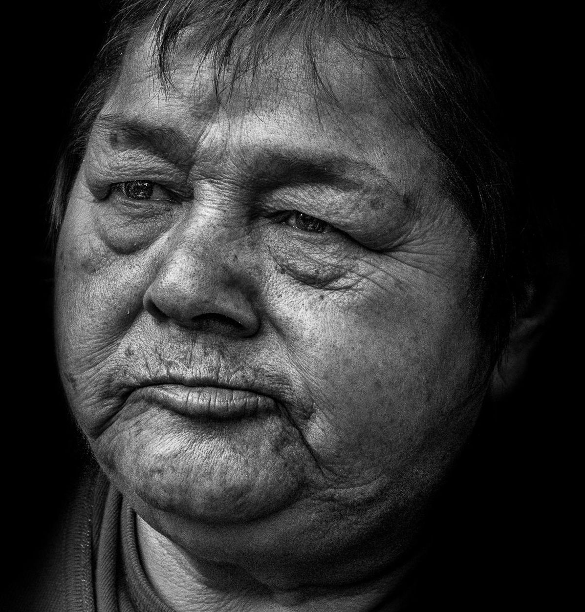 headshot, studio shot, person, young men, lifestyles, close-up, black background, young adult, human face, leisure activity, front view, mid adult, indoors, portrait, mid adult men, looking at camera, serious, contemplation