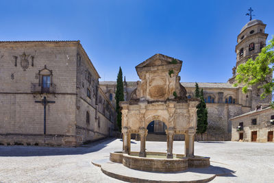 Old ruins of building against clear blue sky