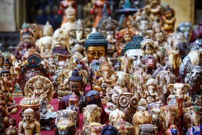 Statues at market stall for sale
