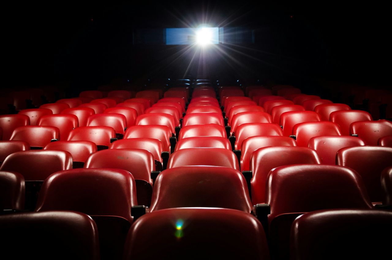 in a row, empty, seat, red, indoors, no people, chair, arrangement, auditorium, backgrounds, illuminated, day