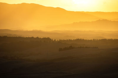 Scenic view of silhouette landscape against sky during sunset