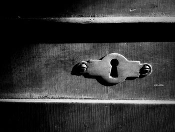 Close-up of door knocker on wood