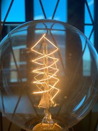 Low angle view of illuminated light bulb