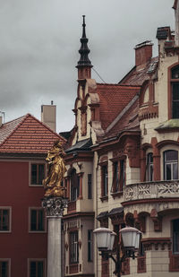 Low angle view of buildings in city against sky