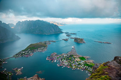 High angle view of bay and mountains against sky, lofoten, norway