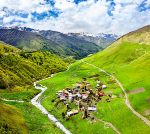 Scenic view of landscape and mountains against sky