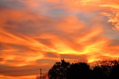 Low angle view of dramatic sky during sunset