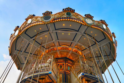 Low angle view of ferris wheel against sky