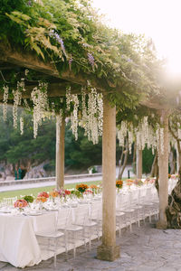 View of decorated place sitting during wedding ceremony