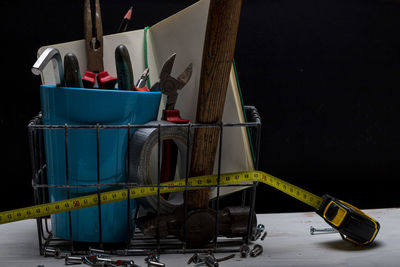 Close-up of objects on table against blue background